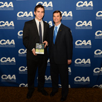 Smith receives his defensive player of the year award at the CAA banquet.